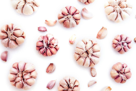 Top view of garlic bulb as pattern background on white