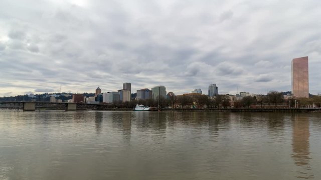 Time lapse movie of moving clouds and sky over Portland OR downtown city skyline along Willamette River 4k Uhd 4096x2304