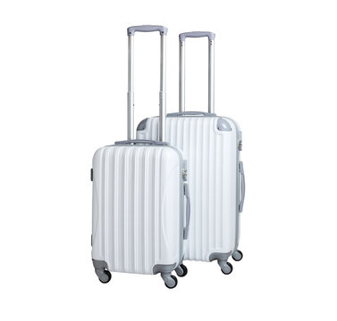 Two suitcases isolated on white background. Polycarbonate suitcases isolated on white. White suitcases.