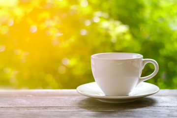 Close up white coffee cup on the table at morning time