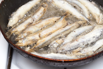 capelin in the flour fried in a pan
