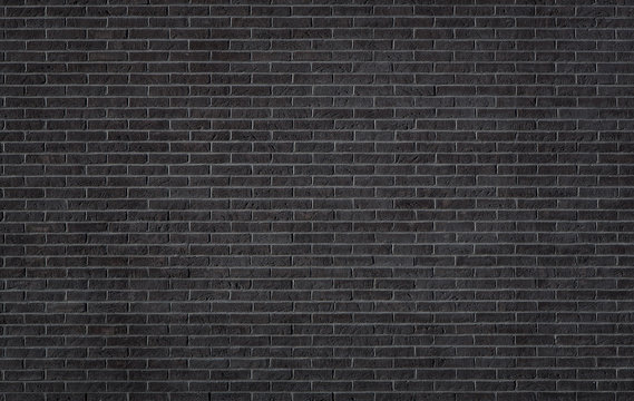 Black brick wall texture, background with copy space