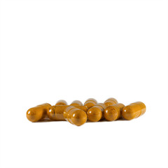 Herbal inside a  capsule isolated on white background,Turmeric powder