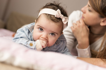 Baby chewing her hands