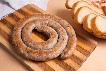 Baked traditional homemade sausage with spices and herbs..