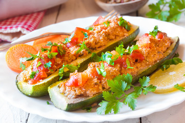 Zucchini stuffed with meat and vegetables