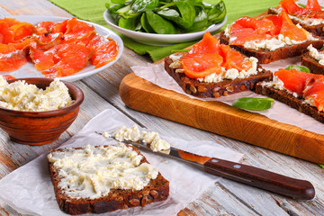 rye bread toasts with cream cheese and salmon