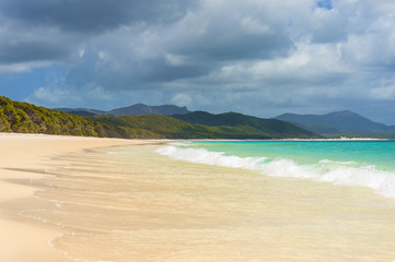 Beautiful tropical beach and sea wave on sandy shore