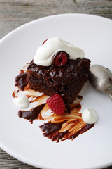 Slice brownie with raspberry
