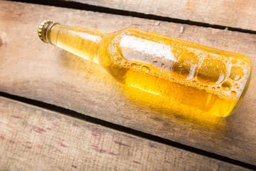 Beer bottles on a wooden table .