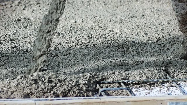 Pouring concrete mix on concreting formwork. Forming, an essential part of the entire building process. Before concrete can be poured, forms need to be built to hold the concrete in place