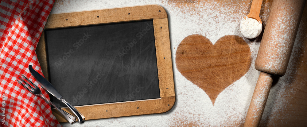 Poster baking background with a heart of flour and empty blackboard