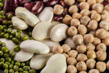 mix of beans on wooden table