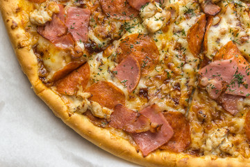 Pizza close up photo, meat ingredients: ham, bacon, chicken breast, delicious 