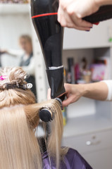 Fototapeta premium Styling female hair dryer