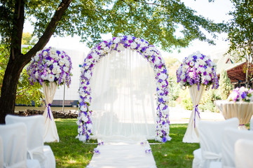 Wedding Arch on the nature of the white and purple shades.