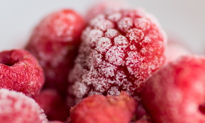 The macro shot of frozen red raspberry