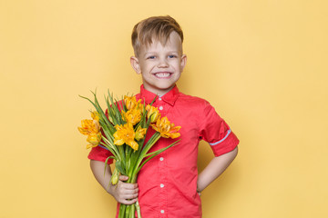 Little beautiful child with pink shirt gives a bouquet of flowers on Women's Day, Mother's Day....