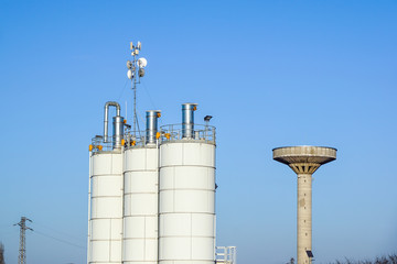 Silver Grain Silos with blue sky in background