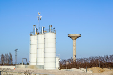 Silver Grain Silos with blue sky in background