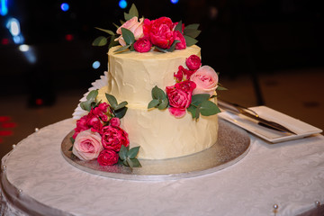 sweet wedding cake with candy bar, muffins, cakes and sweets in area of wedding party. Concept of advertising scenery of food and desserts