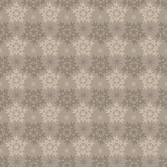 Abstract seamless beige and brown snowflake vector pattern.