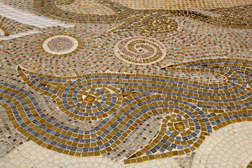 Colorful ceramic pattern decoration with pebbles made from pebble and ceramic on the wall at Wat Phasornkaew., Phetchabun Province, Thailand..