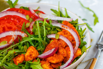 Salad with arugula and chicken. Healthy green food concept.