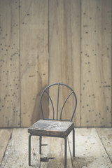 mini wooden chair with wood wall