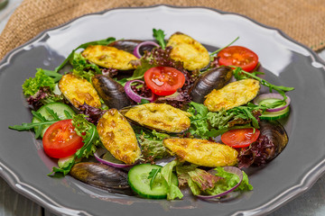 Fresh vegetable salad, healthy food, organic cucumbers,
mussels, tomatoes and salad leaves