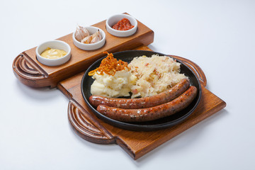 grilled sausages, and potatoes on cooking pan