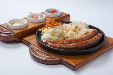grilled sausages, and potatoes on cooking pan