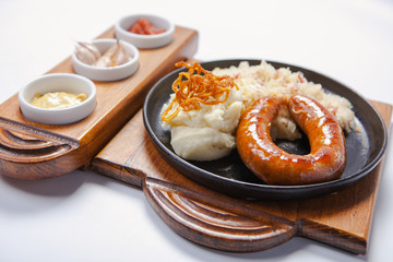 grilled sausages, and potatoes on cooking pan