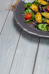 Fresh vegetable salad, healthy food, organic cucumbers,
mussels, tomatoes and salad leaves