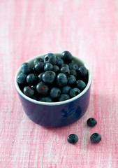 blueberry on wooden surface