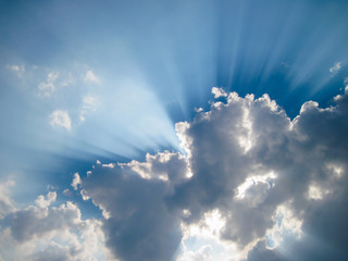 Sun is shining from behind clouds