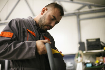 Young worker in workshop.