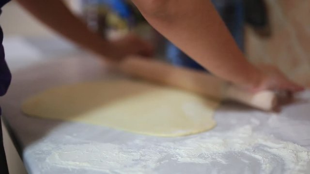 She sculpts dumplings in the kitchen. Girl cooking food.