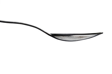 A spoon close on the side isolated on a white background