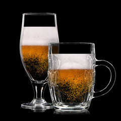 Silhouette of beer glasses with bubbles on a black background
