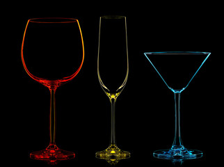 Silhouette of multicolor different glasses on black background