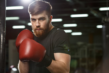 Concentrated handsome young strong sports man boxer