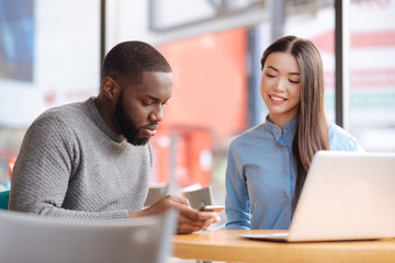 Young couple sitting at table