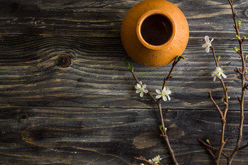 Flowering branches on a wooden table. Spring time.