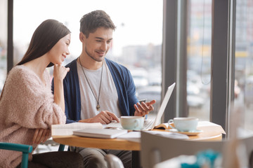 Young guy and woman working together