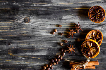 Dried lemon slices with cinnamon and coffee beans on a wooden table. Natural product.