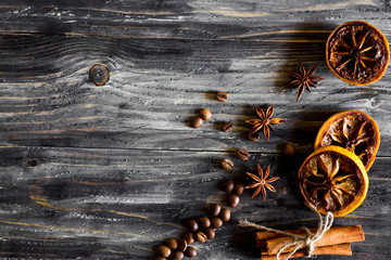 Dried lemon slices with cinnamon and coffee beans on a wooden table. Natural product.