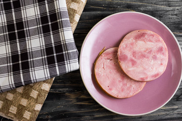 Ham on a wooden table in rustic style