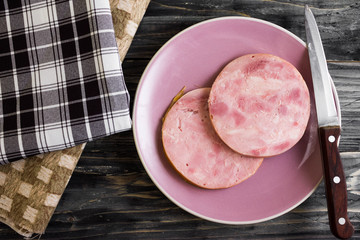 Ham on a wooden table in rustic style