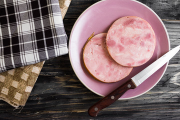 Ham on a wooden table in rustic style